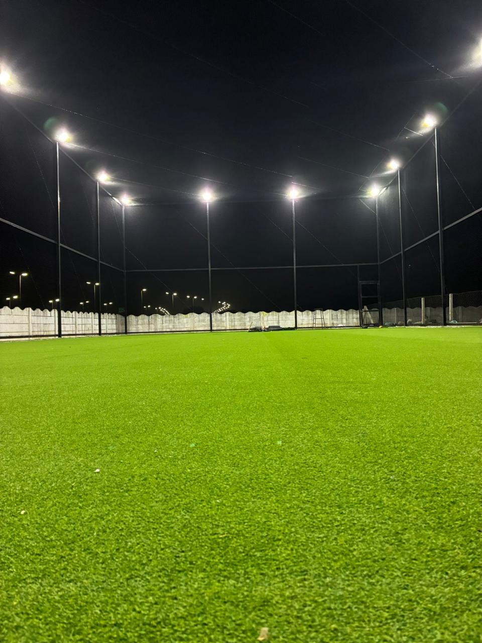 Low angle across the turf towards the floodlights
