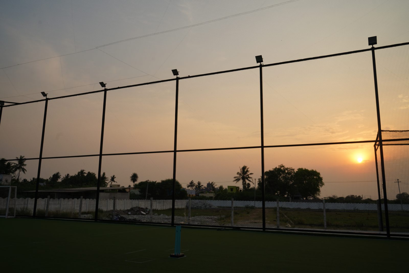 Sunset behind the netted turf